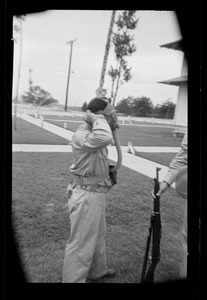 U. S. Army soldier adjusting gas mask, Fort Belvoir