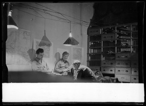 Jerome Mottola, Armas Nilson, and an unidentified soldier, of the U. S. Army's 649th Engineering Battalion, playing cards, Fontainebleau, France