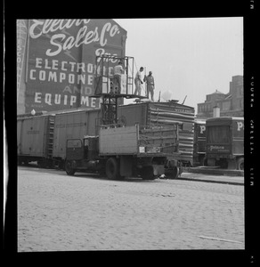 Men loading ice into boxcar, Quincy Market Cold Storage, Sargent's Wharf, Boston