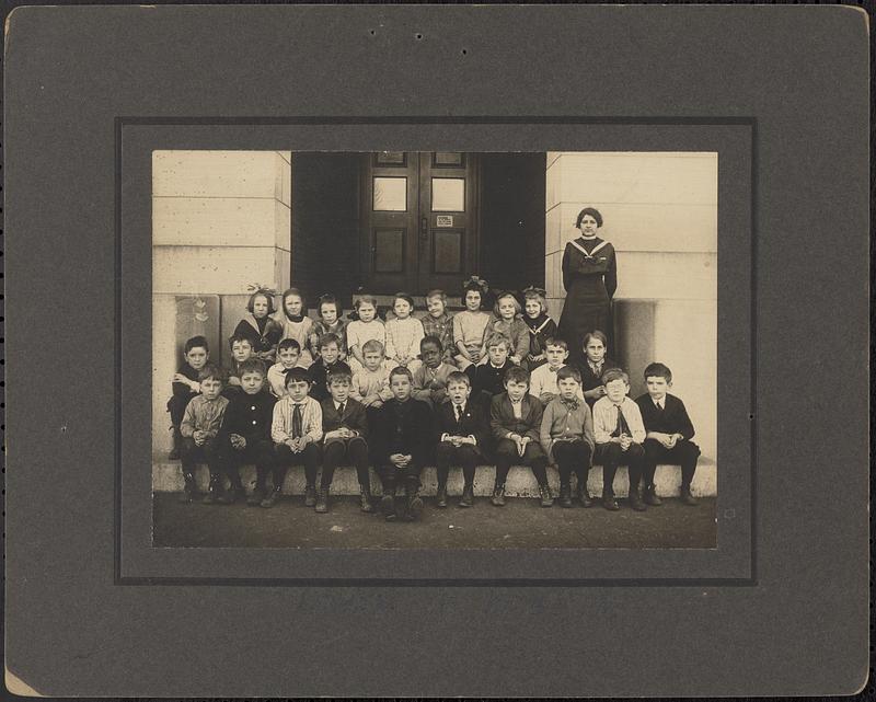 Students in front of Shattuck School with teacher