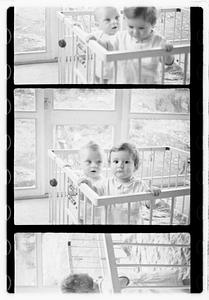 Two children in a playpen