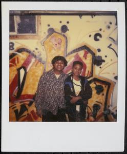 Posing in front of graffiti wall in back of teen program room