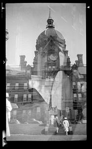 A domed building, people climbing stairs I foreground