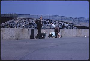 People fishing at wall, likely Boston