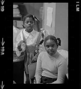 Black schoolchildren play recorders, Roxbury