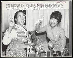 O.J. Simpson of USC, the nation's leading college runner and winner of the 1968 Heisman Trophy has a proud family rooting for him in his hometown of San Francisco 11/27. They are his mother, Mrs. Eunice (L) and sister, Carmelita Simpson (R) as they show off some of the trophies the Heisman winner won in the past.