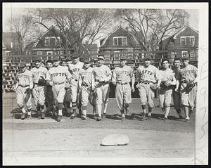 Coach and Judge Kenneth Nash of the Tufts baseball squad, third from the left, leads the Jumbo diamond candidates in a jog around the diamond at the Medford Oval. Included in the group are Alton Bennet, Francis McGee, Albin Galuszka, George Chiros, Pop Storosta, John Wallwork. Italo Solvestri, Ed Nalband, John Gaieski and Bill Alba.