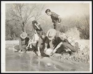 Hunting for gold is one of many diversions found on a western dude ranch.