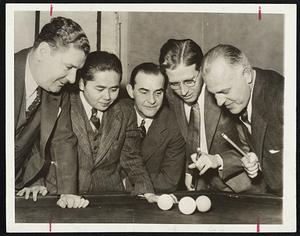 It's a tough problem which brought these five three-cushion billiard aces into a huddle at the current Chicago tournament. Left to right-Allen Hall, Kinrey Matsuyama, Otto Rieselt, Jay Bozeman and Willie Hoppe.