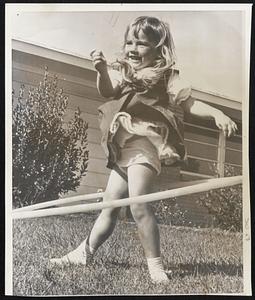 Both The Hula Hoop and the "twist" have slipped in popularity recently, but how many people mastered the art of doing both at the same time? Three-Year-Old Beth Frickle of Savannah, Ga., gives a convincing demonstration.