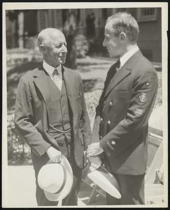 Charles Francis Adams, secretary of the navy, and his son, Charles Francis Adams, Jr., to whom he presented a commission as ensign in the naval reserve at exercises in Fogg museum.