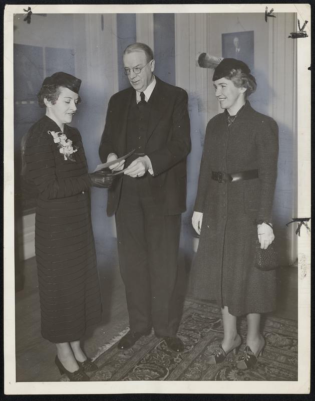 Mayor Mansfield yesterday purchased tickets for the Father Ahern testimonial performance of "Monastery" at the Fine Arts Theatre Thursday night. At the left is Mrs. John a. Ginty, president of Trinity College Alumnae, and at the left (right?) is Mrs. Joseph H. Shortell, honorary president of Bellamine Academy Alumnae. The proceeds of the performance will be turned over to the Father Ahern Fellowship in Seismology fund at College. It will be the world premiere of the film.