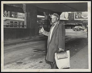 Going My Way? – Ray Etom of Boston, a worker at the General Electric plant in Lynn, tries hitch-hiking at the Eastern Massachusetts Street Railway station in Haymarket square today as a strike of bus drivers and mechanics tied up the system.