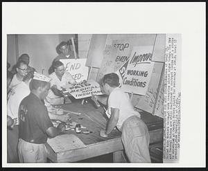 Detroit – Prepare For Auto Strike – Members of Local 15, United Auto Workers Union, at work preparing picket signs today. The UAW and General Motors are still deadlocked on contract issues and a strike is scheduled at General Motors plants for Wednesday at 10 A.M. Local 15 president, Nick Cervelli, is at right.