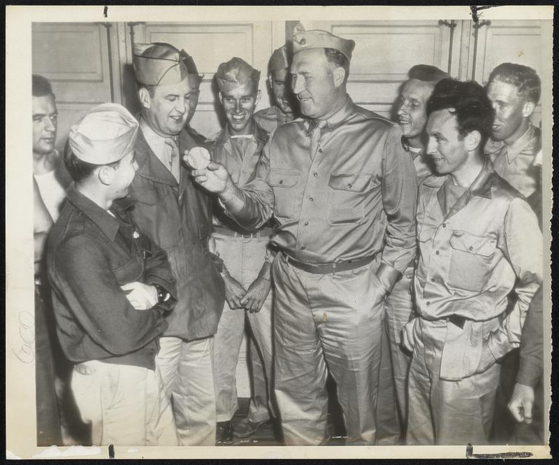 Fair, Fat and Forty, Sergt Charley Ruffing, former Big C of the New York Yankees, does a little baseball juggling at Fort Dix, N. J., where the sergeant, 20 pounds over his old baseball playing weight, awaits his mustering out papers, due tomorrow or Tuesday.