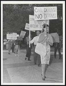 Protest Nuclear Tests – Some of 30 pickets who marched on Boston Common yesterday carrying placards protesting any resumption of nuclear weapons testing. They said they plan weekly marches.