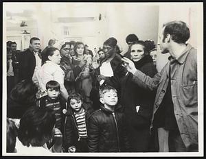 Women on welfare demonstrating at Church street office listen as a man who identified himself as Bill Pascheck of Massachusetts Welfare Rights explain procedures for protest.