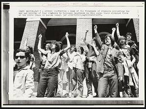 Student Protestors - Some of the thousands of students protesting the war and killing of four students by National Guardsmen in Ohio raise their clenched fists at the State House in Boston today.