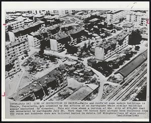 Line Of Destruction In Skopje -- Walls and roofs of some modern buildings in Skopje, Yugoslavia, are crumbled by the effects of an earthquake while similar buildings appear unscathed by disaster. This air view shows a portion of the city of 270,000 that was devastated by earthquake July 26. More than 700 bodies have already been recovered from the ruins and hundreds more are believed buried in debris.