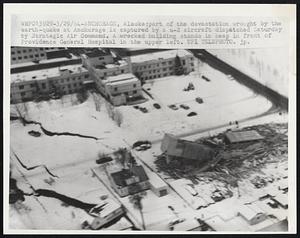 Part of the devastation wrought by the earth-quake at Anchorage is captured by a u-2 aircraft dispatched Saturday by Strategic Air Command. A wrecked building stands in heap in front of Providence General Hospital in the upper left.