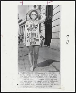 Switch-Board Girls Strike -- Hundreds of Oregon CIO communications workers went on strike today against the Pacific Telephone and Telegraph company. The day was warm, so Janet Holm, Portland, wore mostly a picket sign. P.s. she wore shirt and shorts under the sign.