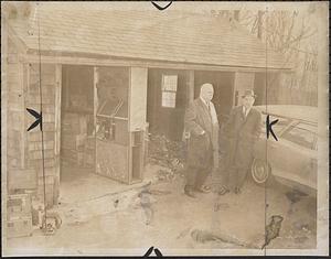 Detectives stand at entrance to converted garage used to hide body of an Abington spinster, Eleanor Badger