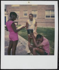 Three friends outside in Newtowne Court