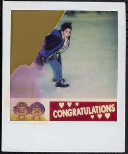 Boy ice skating in a rink
