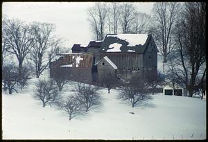 Buildings on snow-covered hill