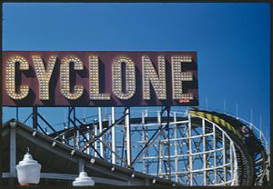 Partial view of roller coaster with sign "Cyclone"