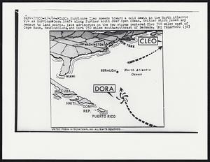 Hurricane Cleo speeds toward a cold death in the North Atlantic 9/4 as Hurricane Dora loafs along further south over open ocean. Neither storm poses any menace to land points. Late advisories on the two storms centered Cleo 310 miles east of Cape Race, Newfoundland, and Dora 750 miles south-southeast of Bermuda.