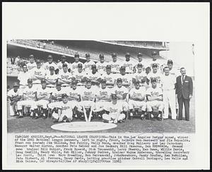National League Champions--This is the Los Angeles Dodger squad, winner of the 1963 National League pennant. Left to right, front, batboys Bob Barisoll and Jim Reynolds. Front row seater: Jim Gilliam, Ron Fairly, Wally Moon, coaches Greg Mulleavy and Leo Durocher; Manager Walter Alston, coaches Pete Reiser and Joe Becker; Bill Skowron, Don Drysdale. Second row: trainer Bill Buhler, Frank Howard, Dick Tracewski, Larry Sherry, Ken Rowe, Willie Davis, Doug Camilli, Maury Wills, Bob Miller, Johnny Podres, trainer Wayne Anderson, traveling secretary Lee Scott. Third row: Mary Breeding, Ron Perranoski, John Roseboro, Sandy Koufax, Ken McMullen, Pete Richert, Al Ferrara, Tommy Davis, batting practice pitcher Carroll Beringer, Lee Walls and Dick Calmus.