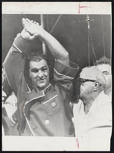 Rocky Marciano with his hands raised
