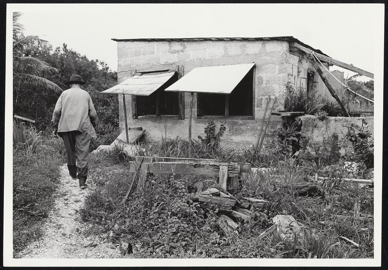 Home for 96-year-old Arthur Darwin is this 14-by-16 shack on Posseum Key, a tiny island in the heart of a watery wilderness inside Everglades National Park, Fla. He cut the blocks himself for the one room concrete building where he lives his hermit existence. The windows have no glass, only screens and wooden shutters. He has no electricity or running water, "just the rain." He goes to bed when it gets dark and rises with the sun. But -- there's no ringing phone and no stack of bills.