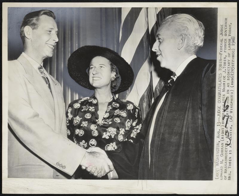 Judge Congratulates Tobin – Federal Judge Edward M. Curran (right) congratulates Maurice J. Tobin, former governor of Massachusetts, after swearing him in as Secretary of Labor today. Mts. Robin is at center.