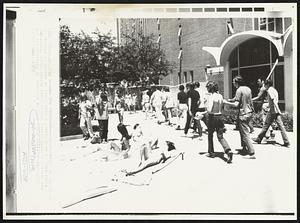 See the Marchers -- Demonstrators at the Univ. of Georgia at Athens at least have a pretty view as they watch sunbathing coeds during march around campus against Vietnam war and the shooting of students at Kent State Univ.