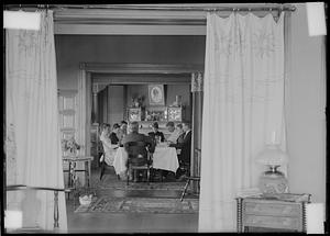 Parker family? seated around dining table