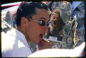 Boston - N. End 2002: A statue bearer talks during a break in the procession of St. Anthony's Feast