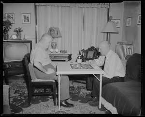 Victor G. Montairs playing checkers [with Leon Abdalian]