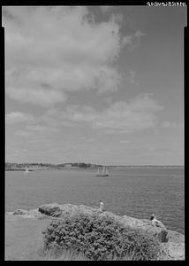 Marblehead, marine, with three onlookers