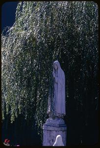 Statue of veiled woman with praying hands