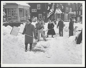 Shoveling Bee - Snow removal became a community project on Grampian Way, Dorchester, yesterday when residents manned shovels to allow passageway along sidewalks.