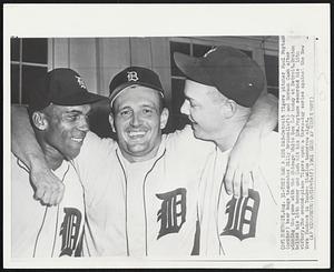 They Had a Big Day - Detroit Tigers pitcher Paul Foytack (center) bear hugs teammates Billy Bruton (left) and Norman Cash after winning the game with the Chicago White Sox 8-2 today at Detroit. Bruton Belted his 16th homer and Cash hit his 32d. Foytack recorded his 10th victory. The second-place Tigers open a three-day series against the New York Yankees in Yankee Stadium tomorrow night.