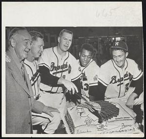 They Knew the Braves Were Coming so the fans of Bradenton, Fla., bakes a 65-pound cake to celebrate the first Milwaukee pennant. Braves team captain Del Crandall prepares to cut the huge piece of pastry. Left to right: Ray Weisbrod, Milwaukee Chamber of Commerce; Red Schoendienst, Crandall, Wes Covington and Don McMahon. The Braves annually have spring training in the Florida resort town.