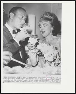 Newlyweds Toast -- Edie Adams, 35, and music publisher Marty Mills, 37, drink a toast following their marriage yesterday at the actress' home. After Hawaiian honeymoon, the couple will make their home in Beverly Hills, Calif.