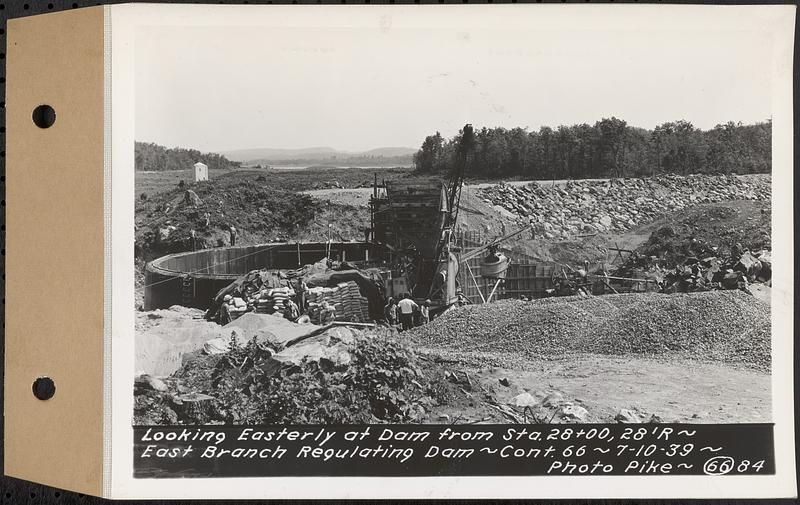 Contract No. 66, Regulating Dams, Middle Branch (New Salem), and East Branch of the Swift River, Hardwick and Petersham (formerly Dana), looking easterly at dam from Sta. 28+00, 28 feet radius, east branch regulating dam, Hardwick, Mass., Jul. 10, 1939