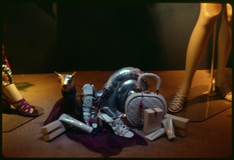 Shoes, purses and toiletries and a figurine of an animal