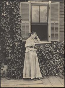 Woman in front of a window