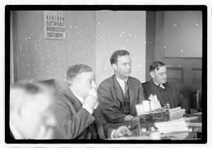 Group of men at table