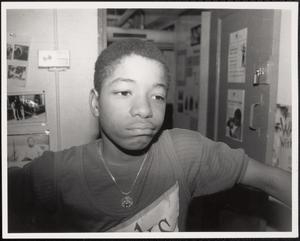 Close up of a boy with a frown